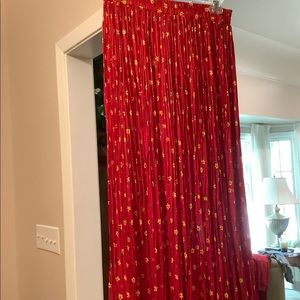 This s is a red broom skirt that is in like new condition.